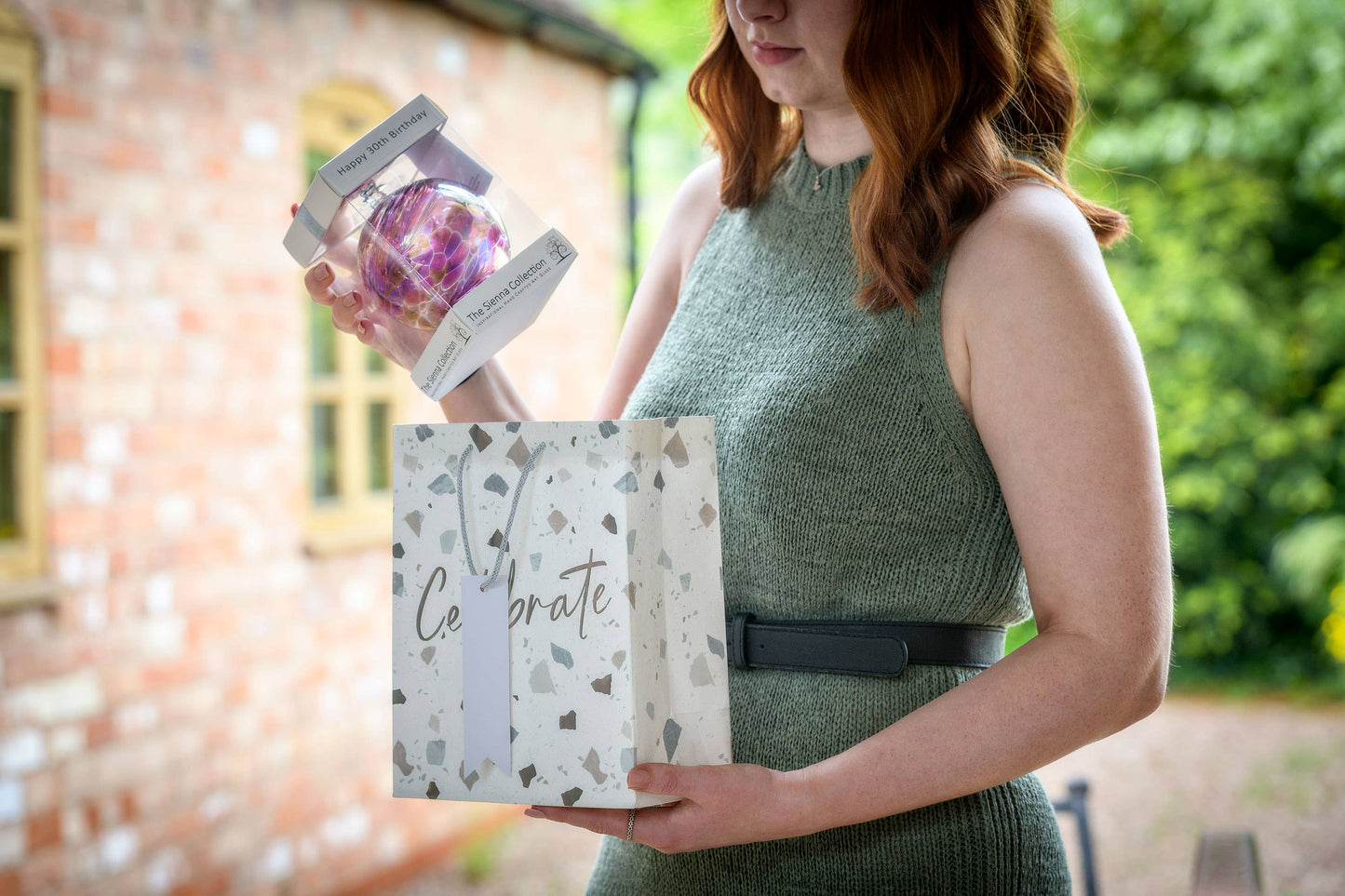 A 10cm glass friendship ball with colorful swirls, perfect for celebrating a 30th birthday.