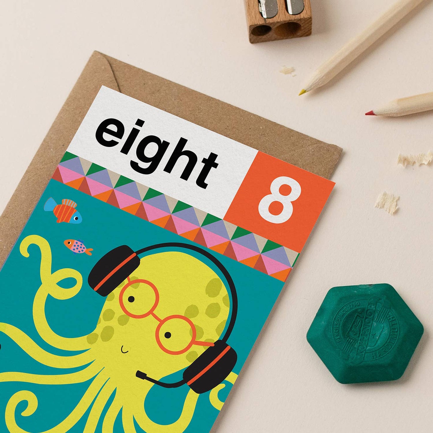 Bright yellow octopus with headphones and glasses on a gaming-themed 8th birthday card.