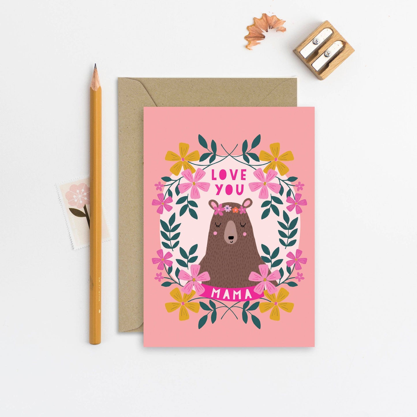 Pink Mother's Day card with illustrated mama bear and floral wreath