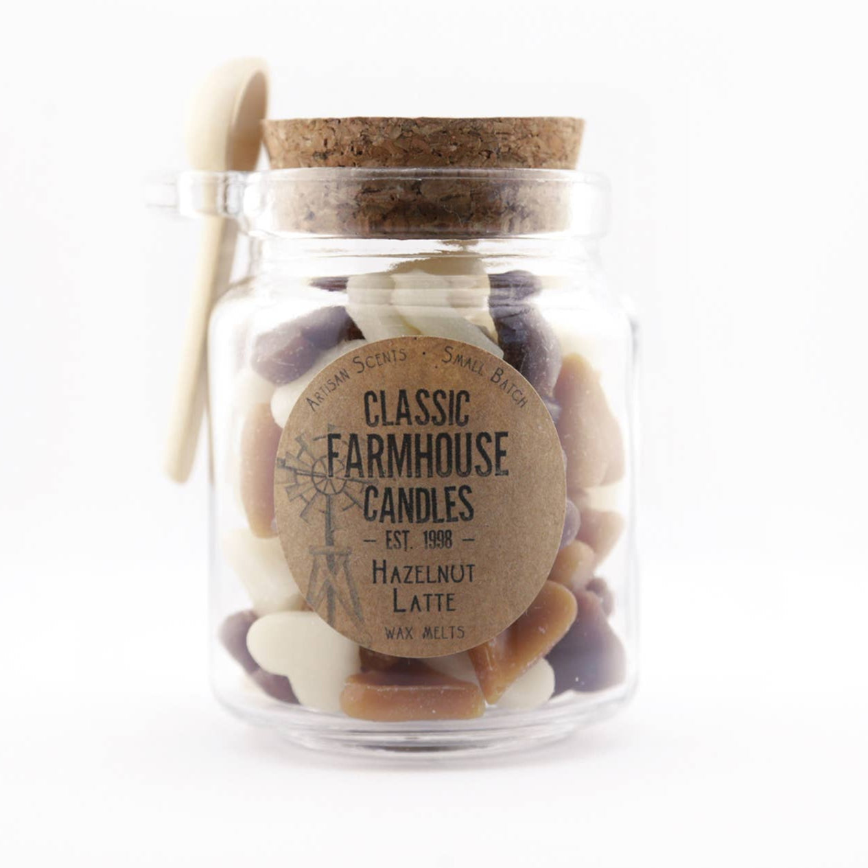 Glass jar filled with heart-shaped wax melts and labeled Hazelnut Latte