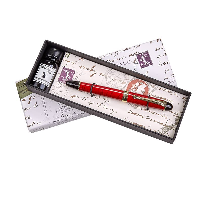 Red fountain pen with matching ink bottle in decorative gift box