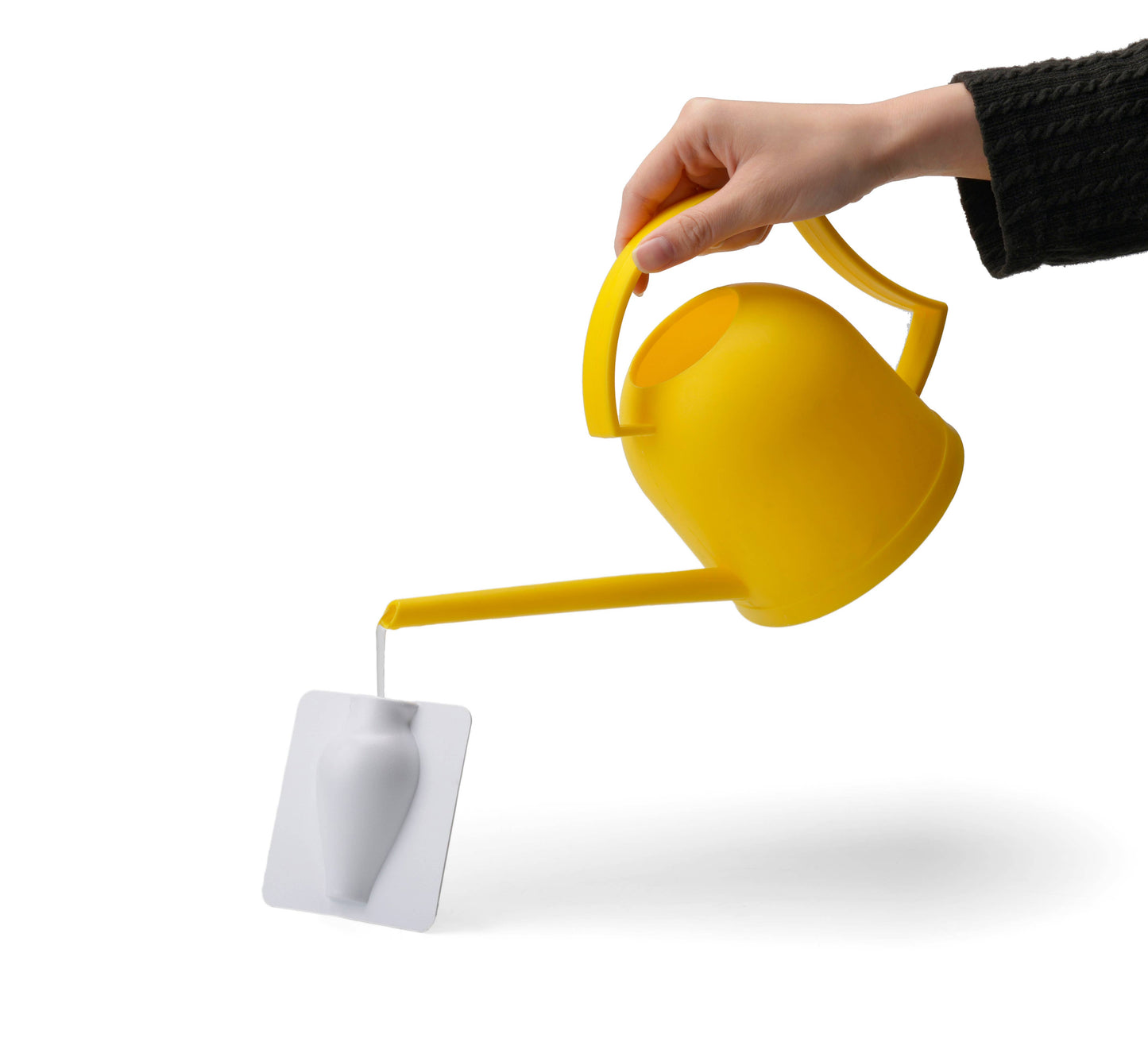 "Bright yellow flip vase in the shape of a watering can, designed for tabletop display with changeable museum art."