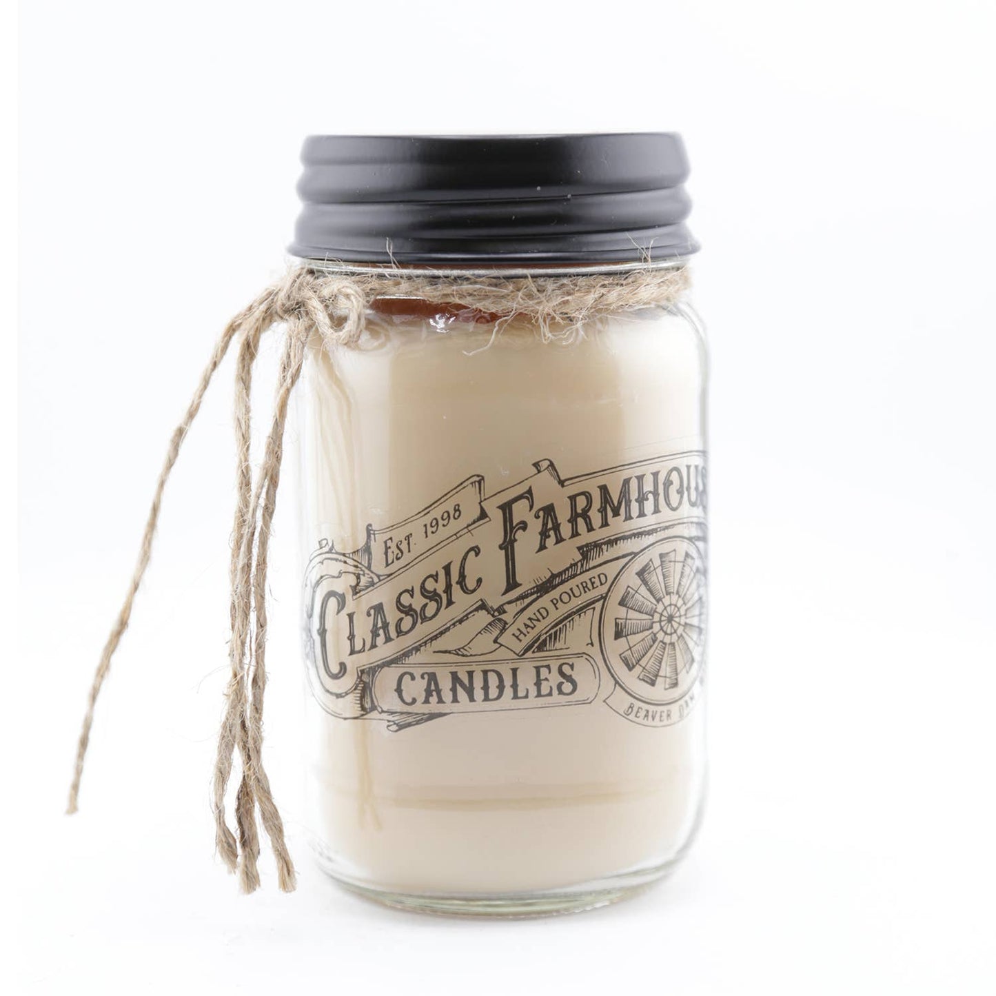 Hand-poured orange upside down cake scented candle in a 14 oz glass mason jar with a black lid and twine bow.