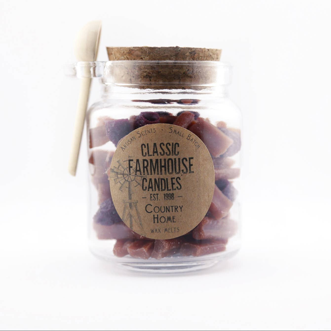Glass jar of wax melts with cork lid and wooden spoon
