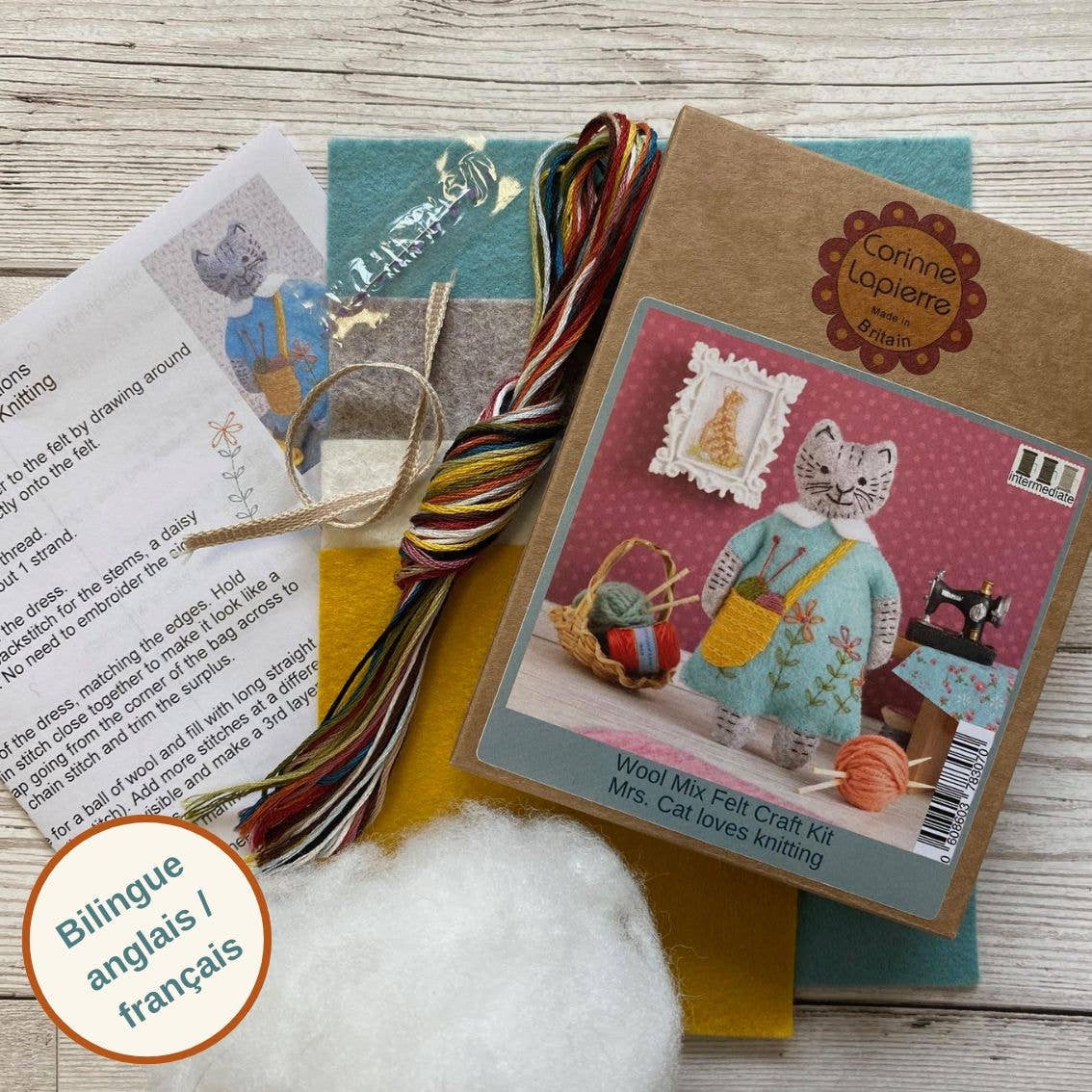 Felt craft mini kit featuring colorful threads, wool mix felt, and instructions for creating a charming cat-themed project.