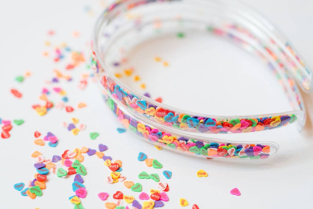 Clear headbands filled with colorful candy heart confetti
