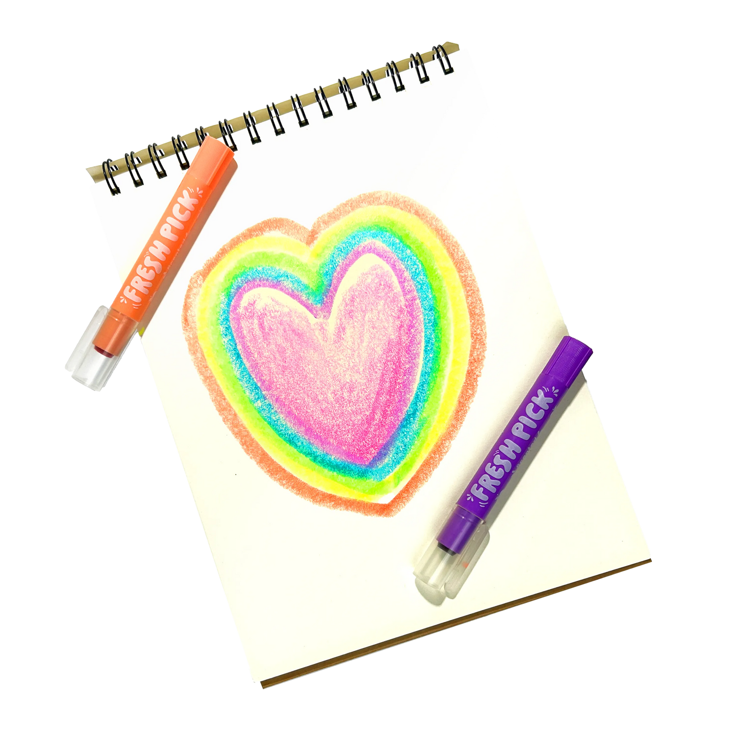 Neon gel crayons in orange and purple, featuring a rainbow heart drawing on a notebook.