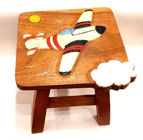 Wooden children's stool with carved airplane flying above a cloud design.