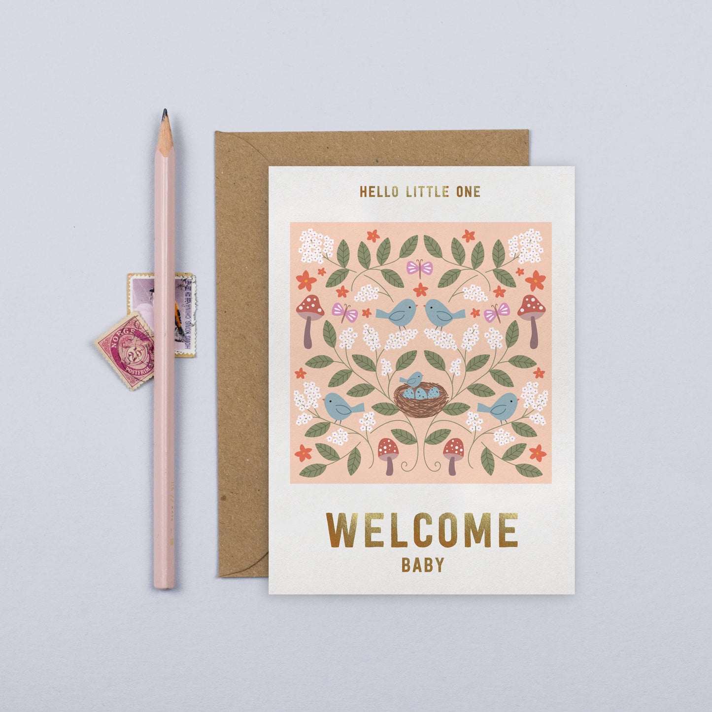 Floral new baby card with birds, mushrooms, and gold foil text