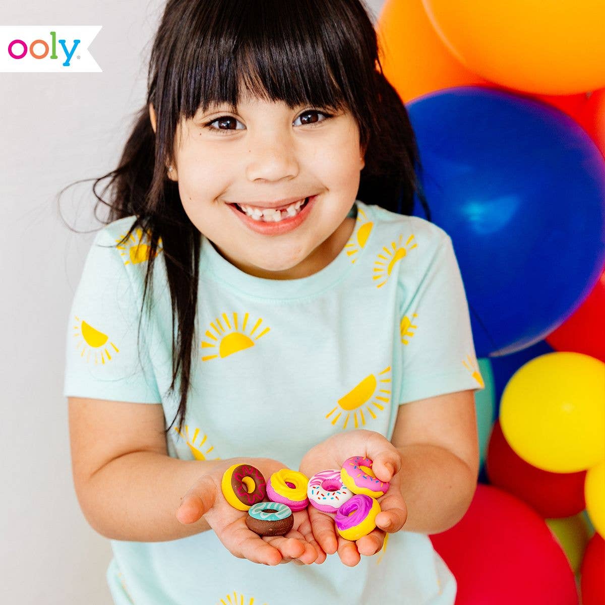 Cute donut-shaped erasers in vibrant colors with sprinkles, perfect for fun and creative writing.