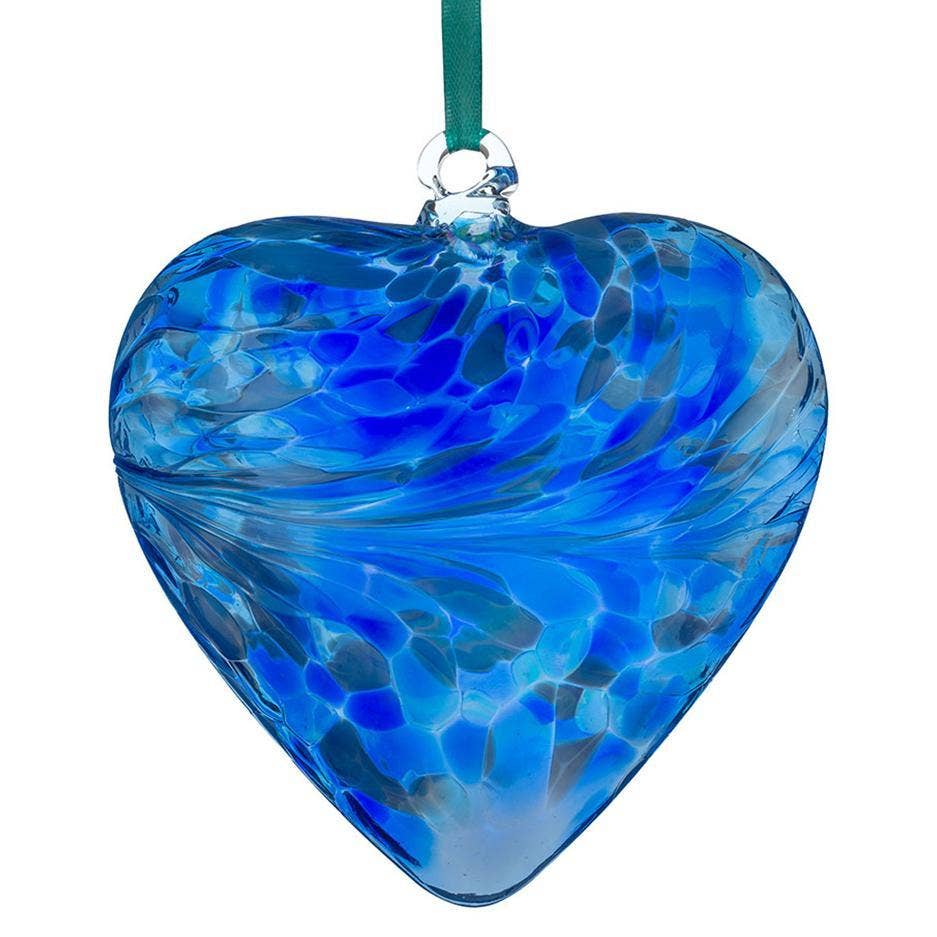 Mouth-blown blue glass heart with swirling color pattern and hanging ribbon