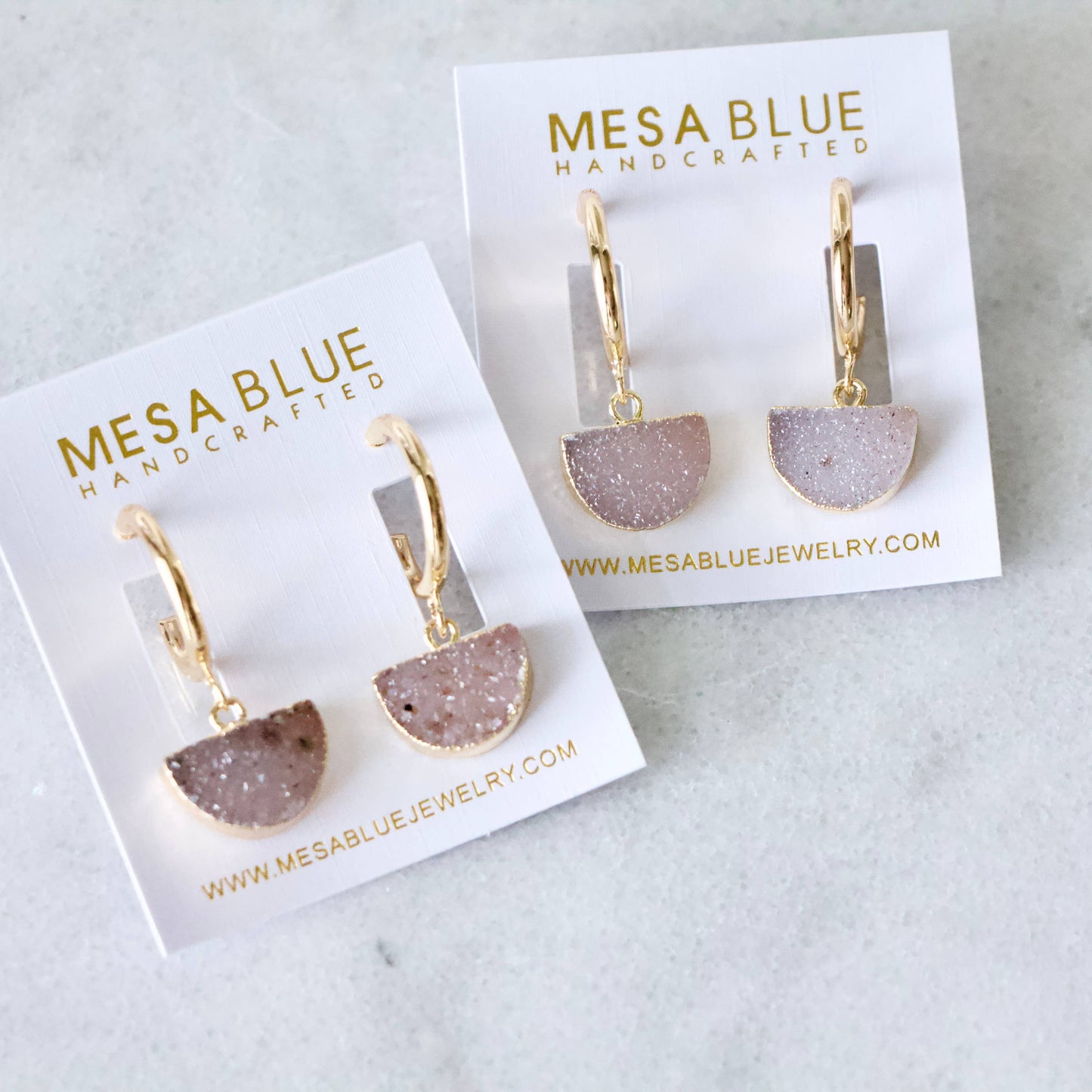 Handcrafted druzy hoop earrings with 18k gold plating and sparkling pink druzy stones.