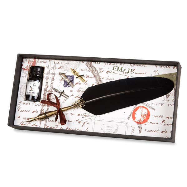 Burgundy feather pen set with brass nib, elegant black feather, and decorative ribbon, perfect for unique gifts.