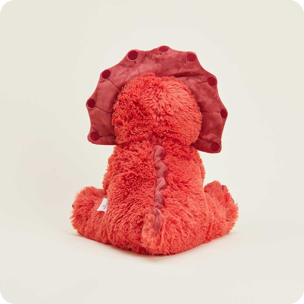 Red plush triceratops toy with soft texture, detailed frill, and soothing design for microwavable warmth.