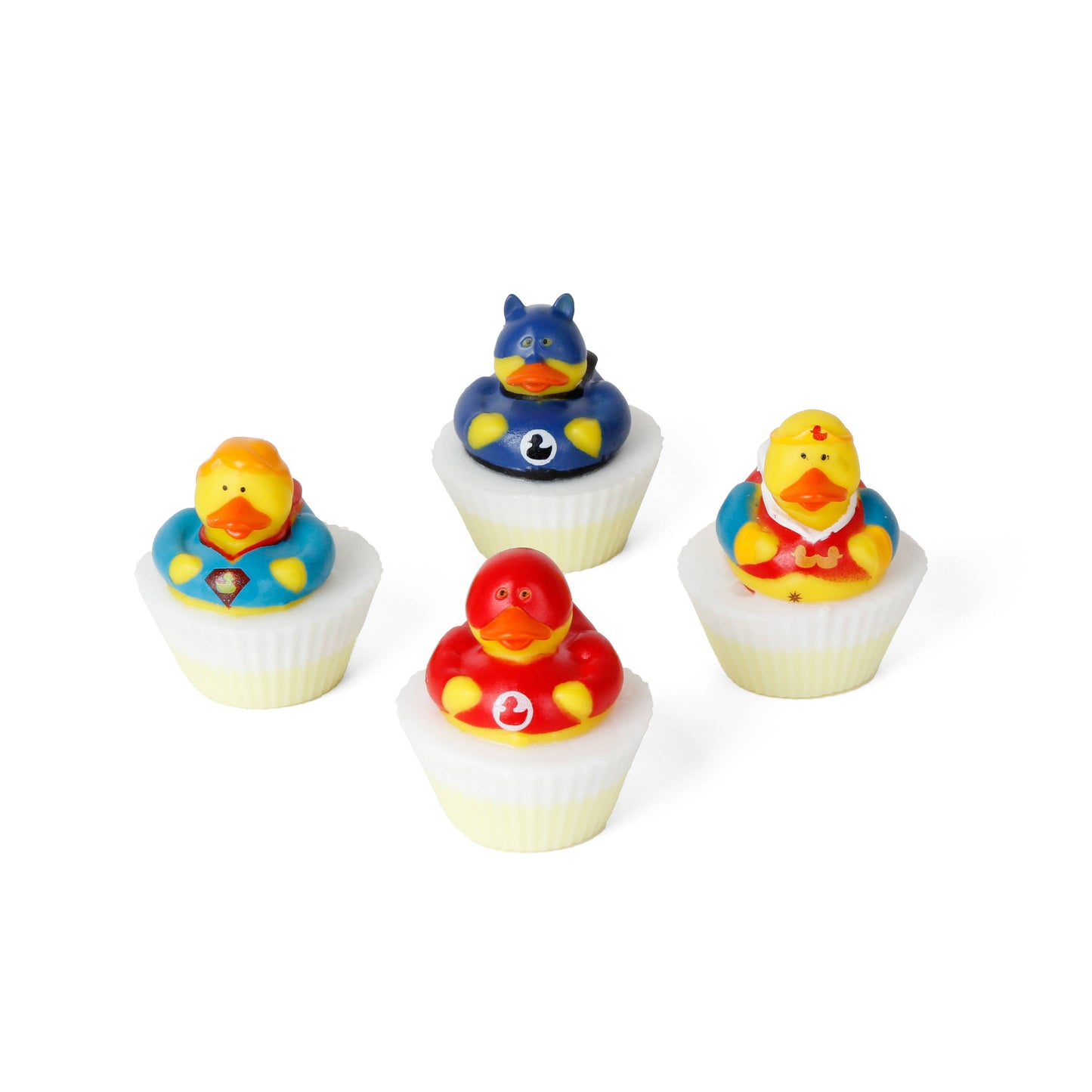 Set of cupcake-shaped soaps topped with superhero rubber duck figures in various costumes.