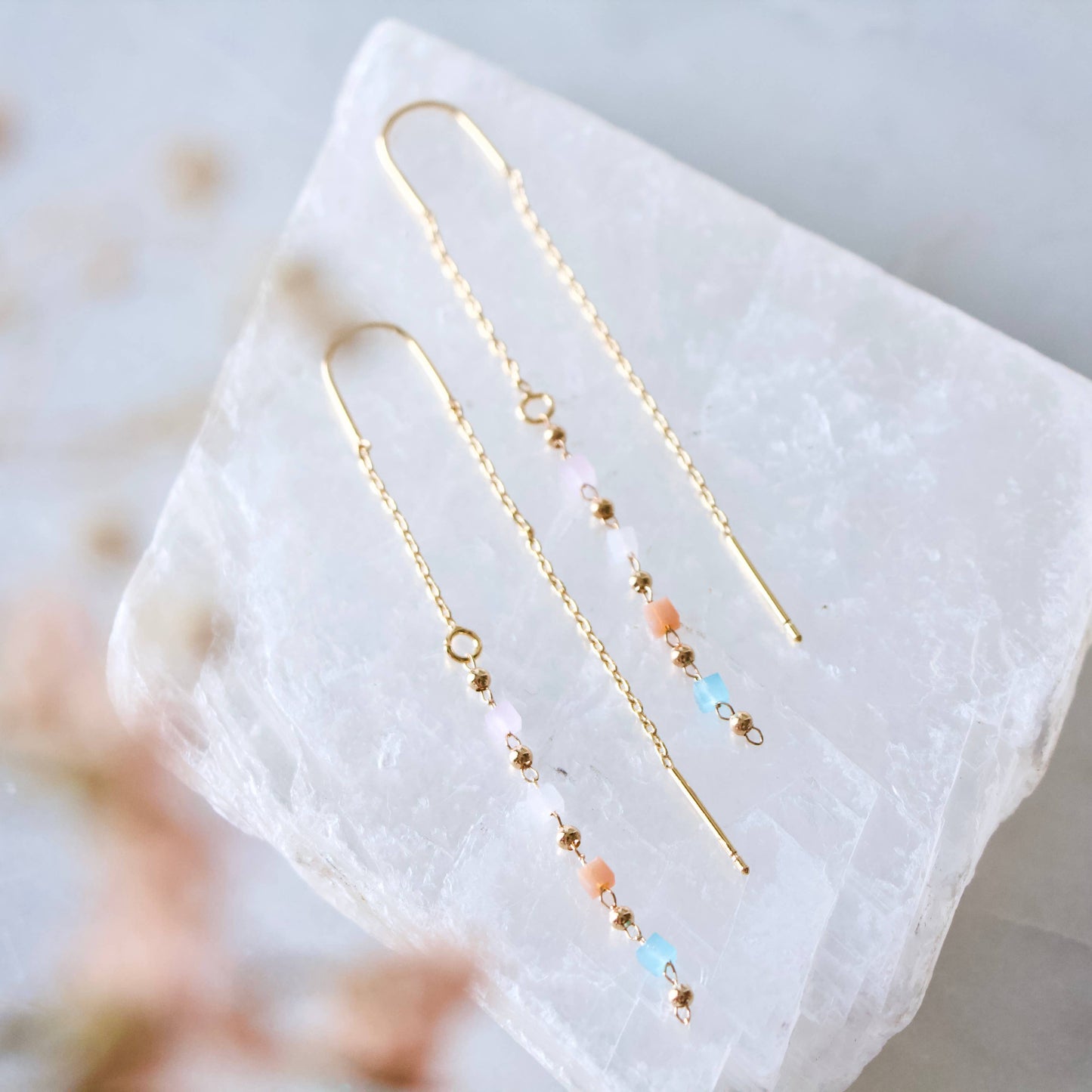 Elegant 24K gold-plated threader earrings with pastel gemstone drops, perfect for a delicate touch.
