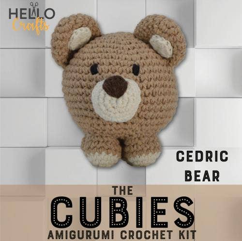 Crochet bear kit featuring a charming brown bear with white accents, perfect for crafting.