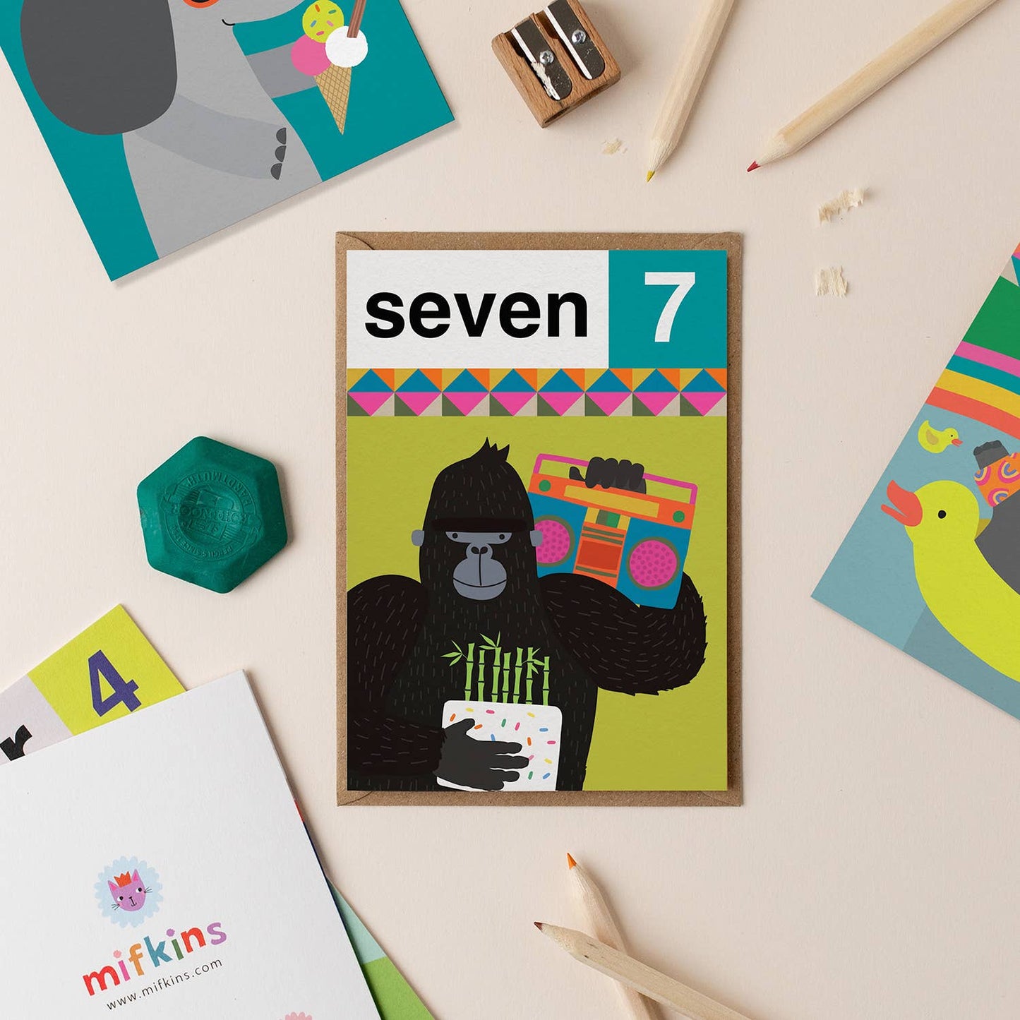 Fun 7th birthday card featuring a playful gorilla with a boombox and cake, perfect for kids.