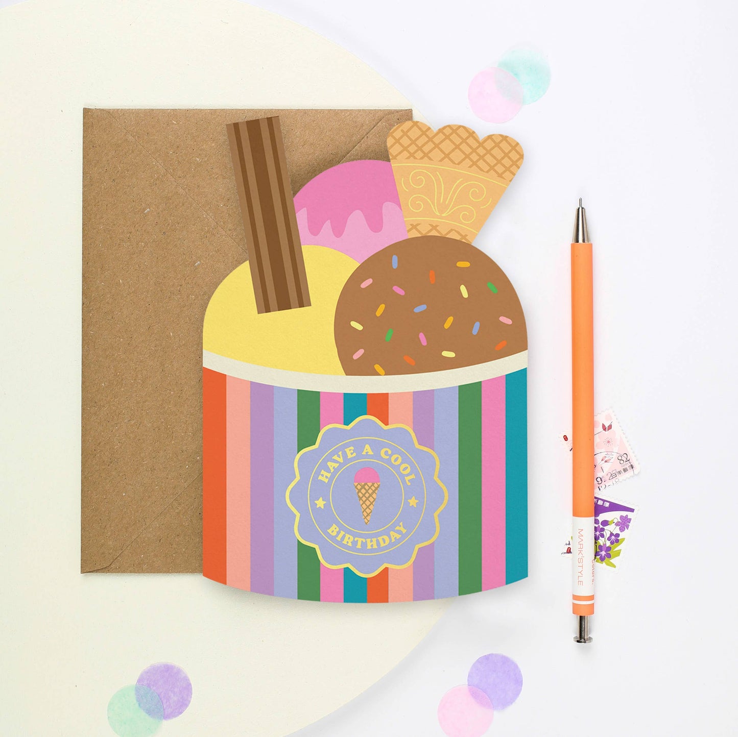 Striped ice cream-themed birthday card with gold foil details and kraft envelope
