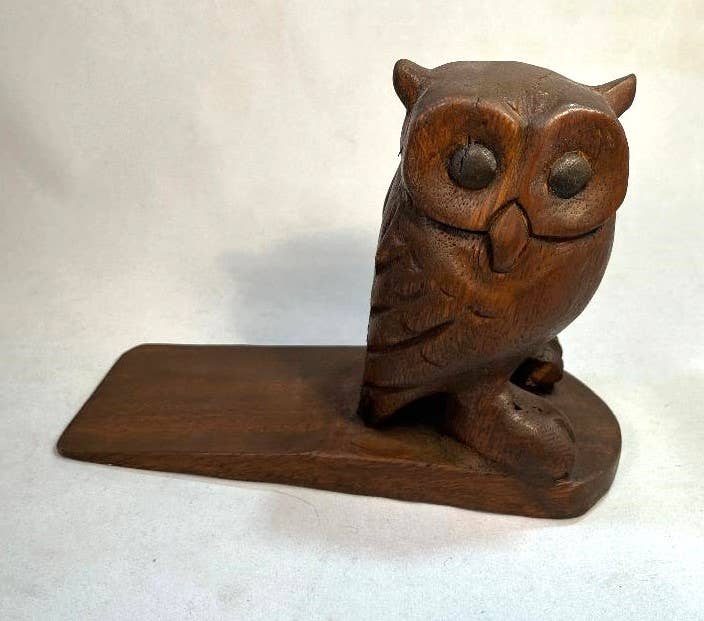 Carved wooden owl doorstop with natural finish