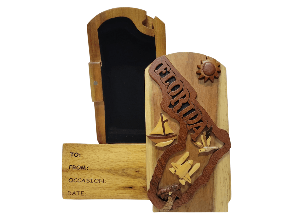 Hand-carved wooden gift box with Florida design, featuring a sailboat, sun, and palm tree details.