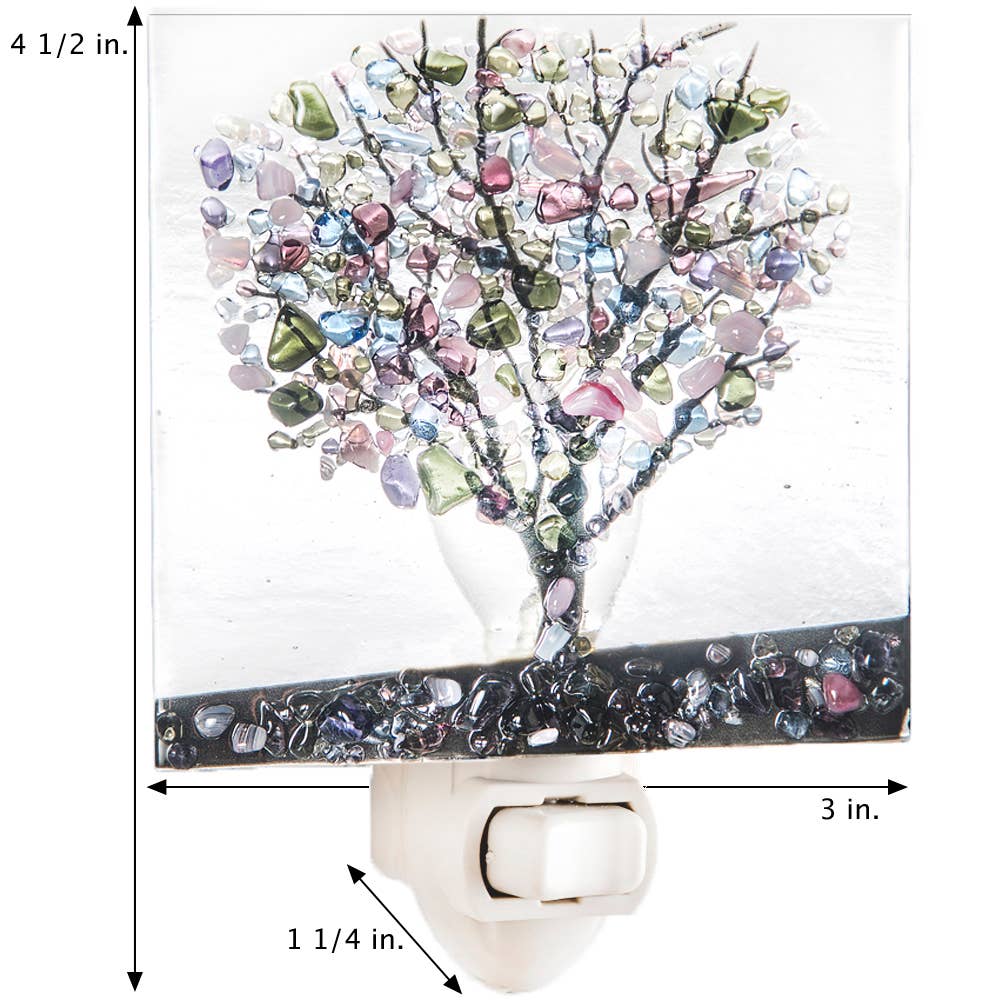 Fused glass night light featuring a colorful autumn tree design with vibrant leaves and a black base.