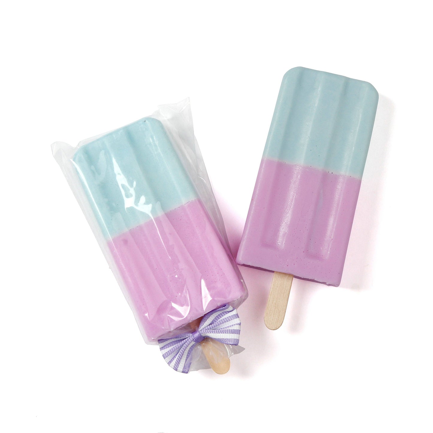 Blue and lavender popsicle-shaped soap bars with wooden stick and bow