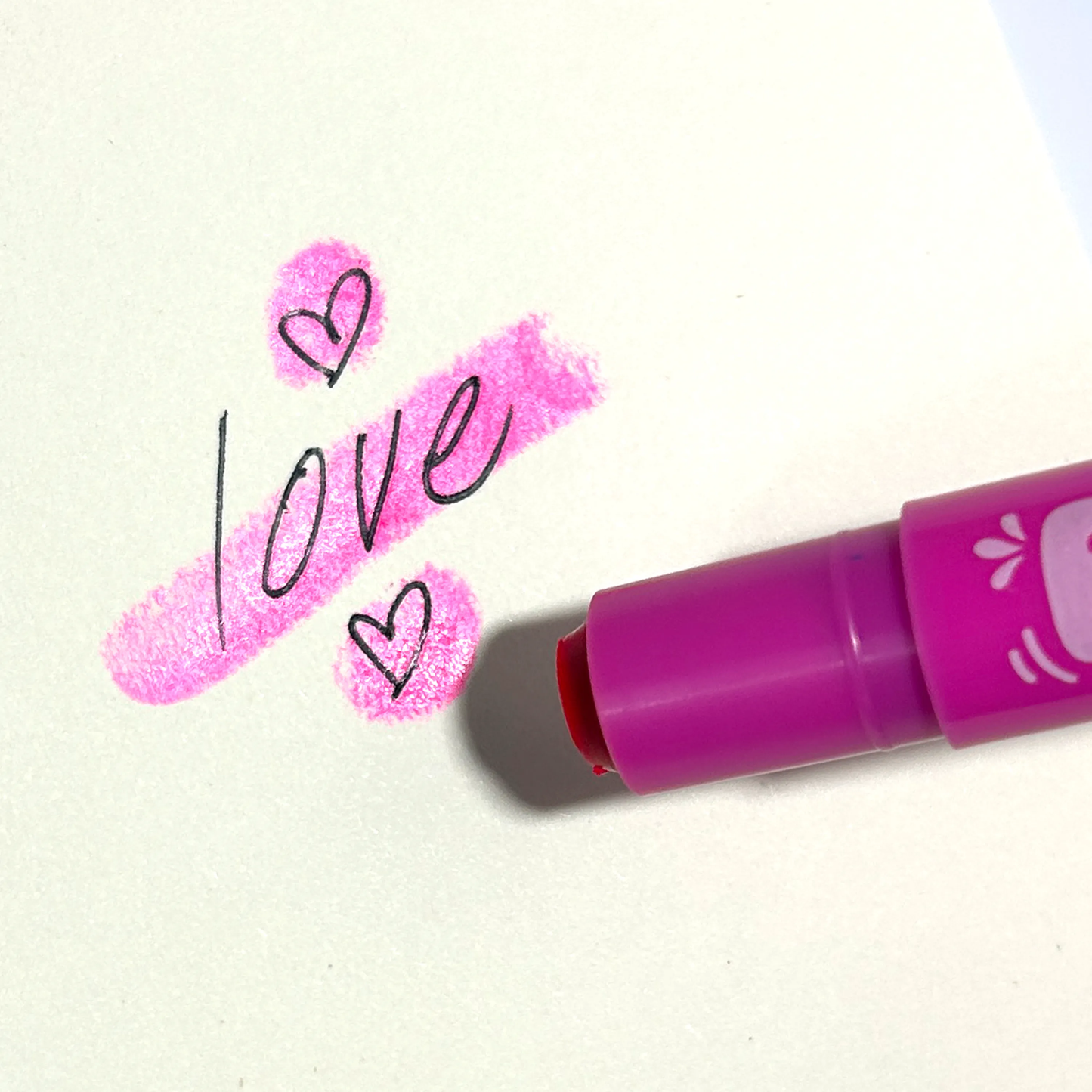 A vibrant pink neon gel crayon with "love" written in cursive, perfect for girls and teens.