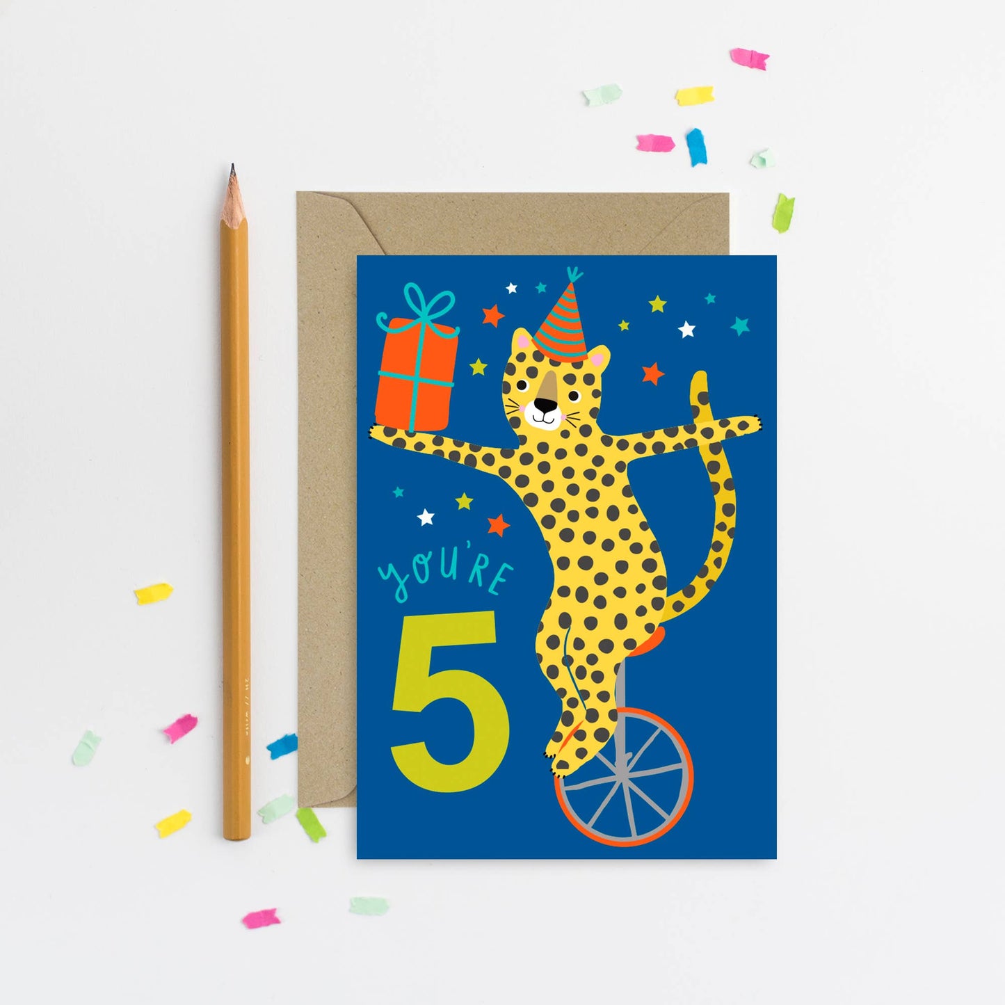 Blue birthday card with illustrated leopard on a unicycle and number 5