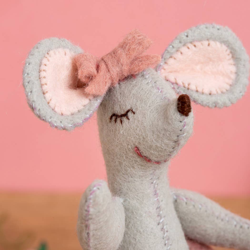 Handmade felt mouse with pink bow, stitched details, and soft gray fur, perfect for crafting.