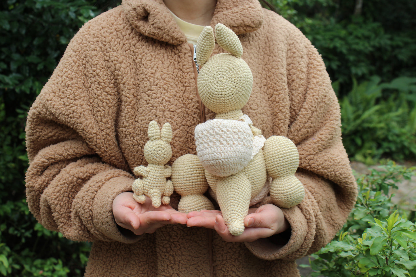 Crochet Kangaroo Set: Two handmade, cream-colored crocheted kangaroos and a joey.