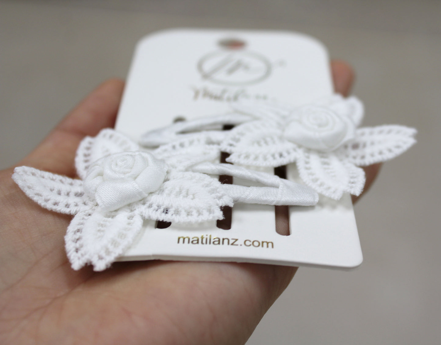 Handmade white flower hair clips with delicate lace and fabric petals, set of 2.