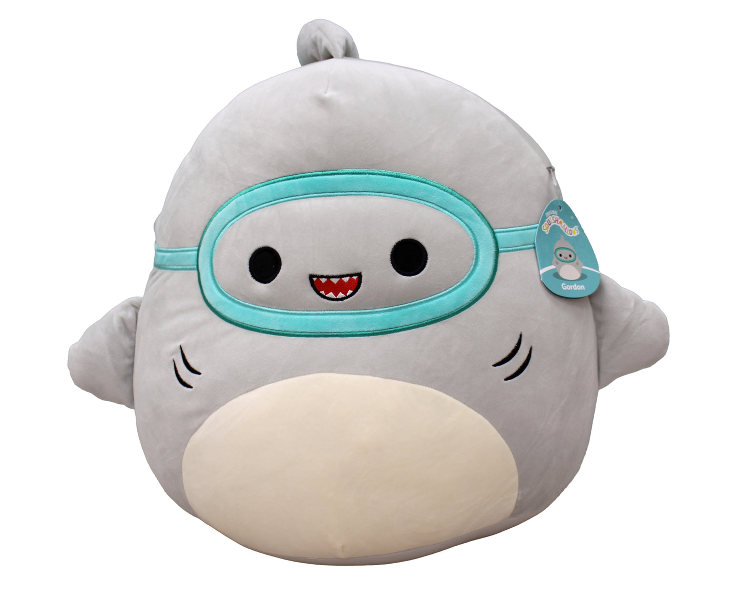 Gordon the gray Squishmallow shark with teal goggles and friendly smile