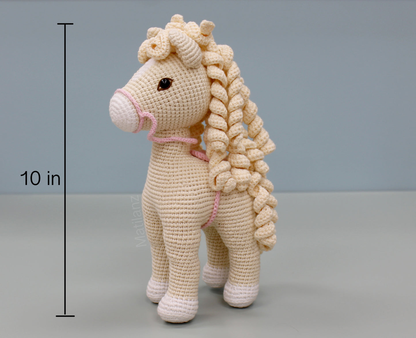 Handmade white crochet horse with curly mane and tail, 10 inches tall.