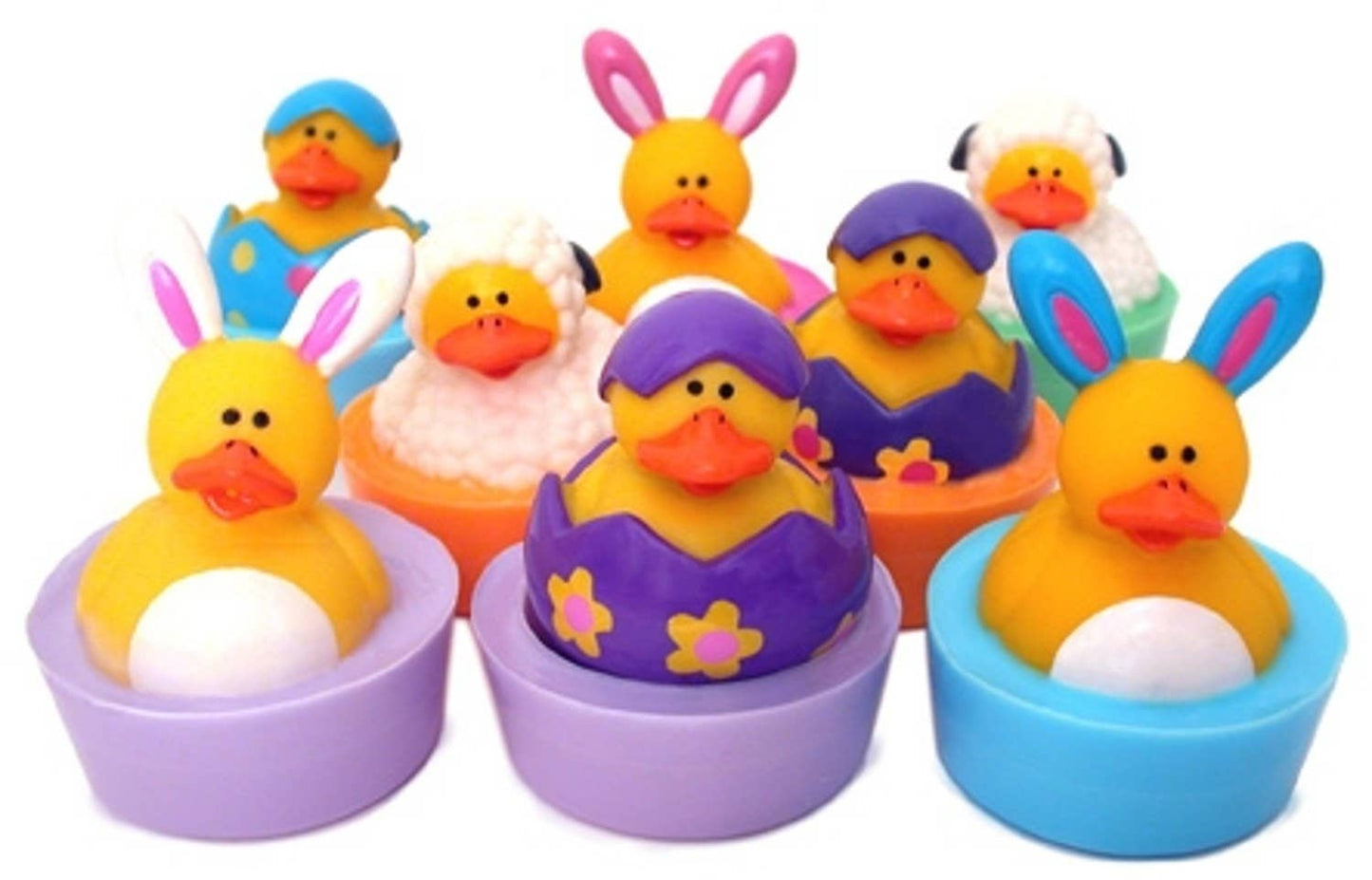 Rubber duck toys dressed as bunnies, lambs, and chicks embedded in pastel-colored soaps.