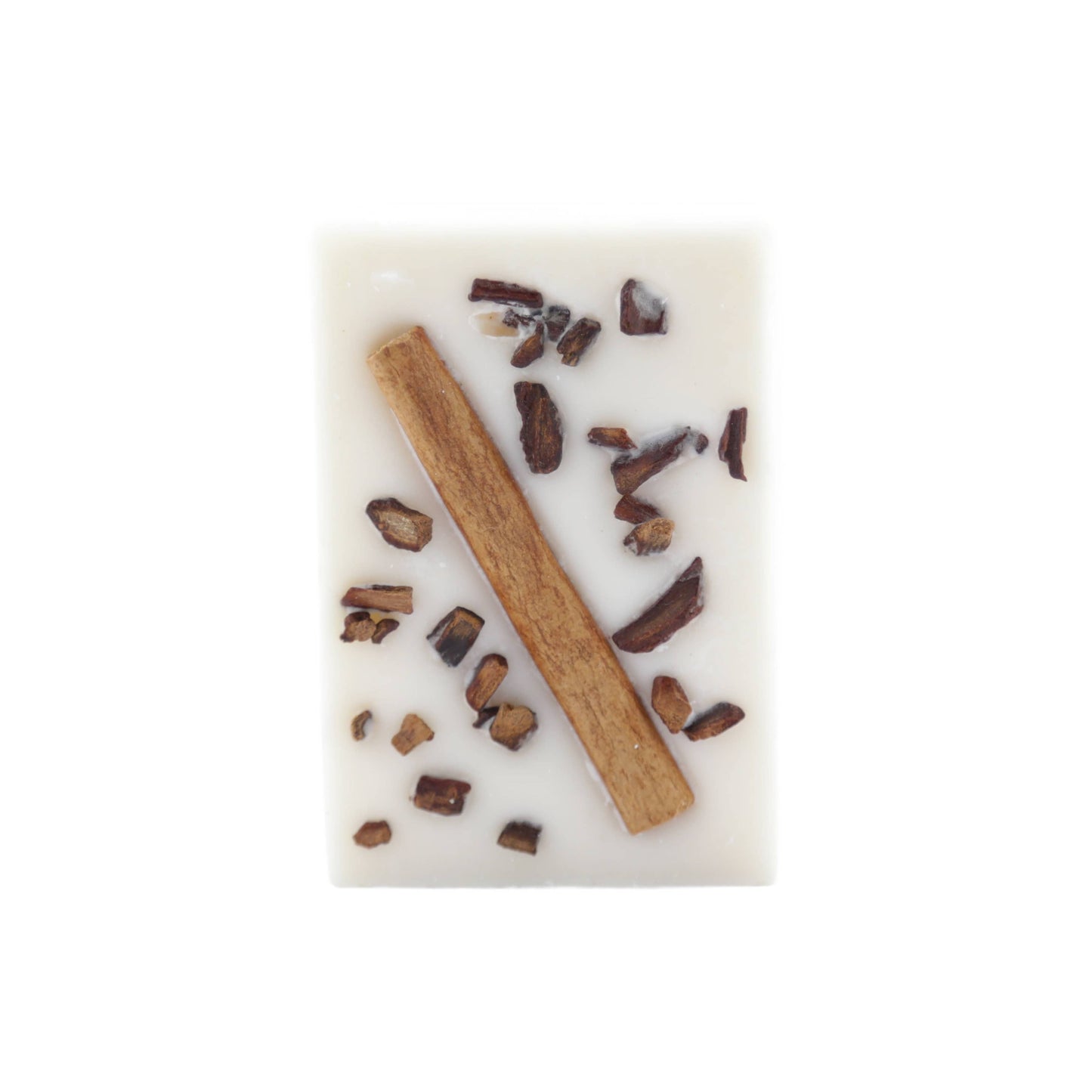 Cream-colored soy wax melt bar with cinnamon stick and spice pieces embedded for a warm, spicy scent.
