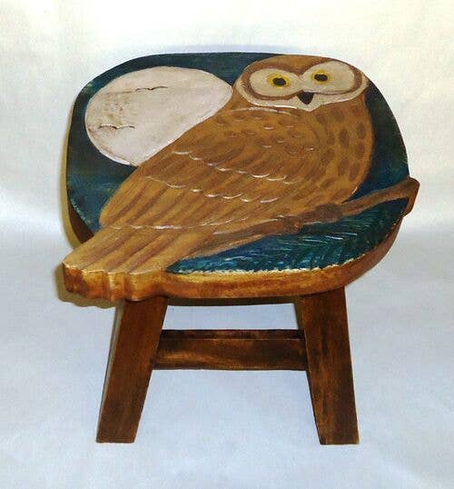Hand-carved wooden owl stool with moonlit background