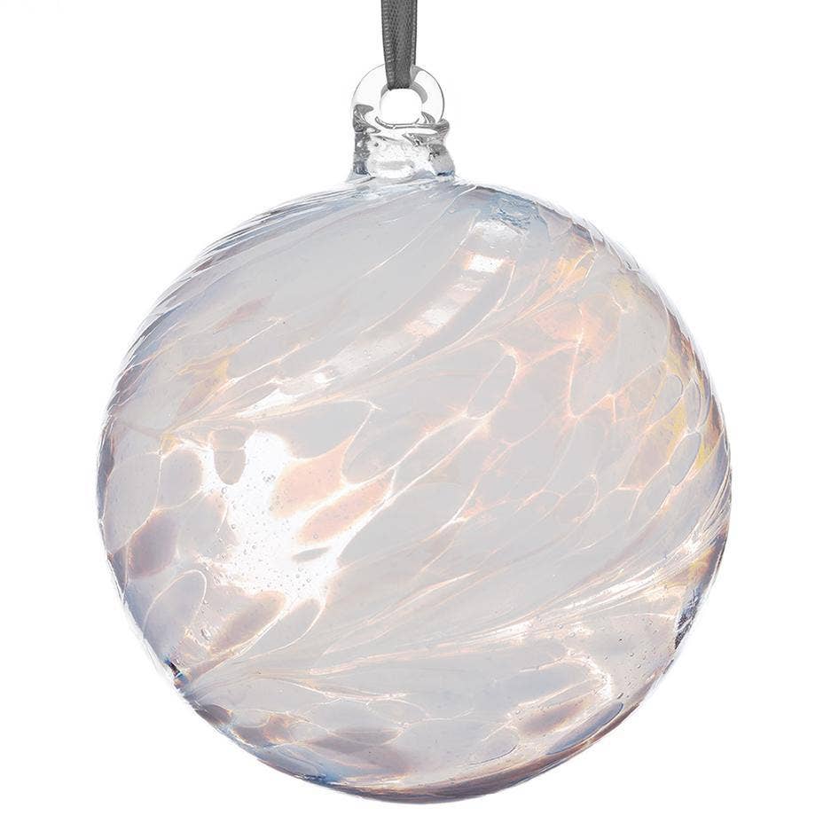 White glass friendship ball with swirling pattern and hanging ribbon