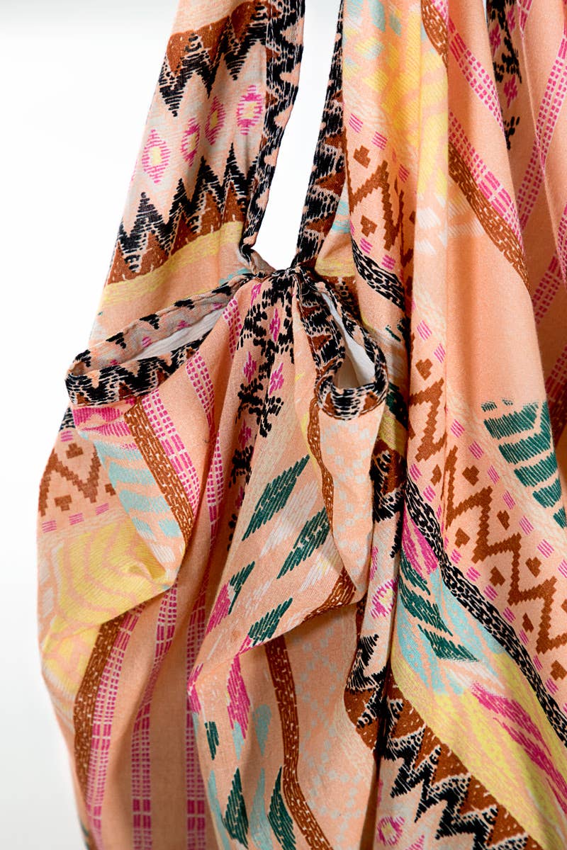 A boho cotton bag with ethnic hand block print in vibrant colors and intricate patterns.