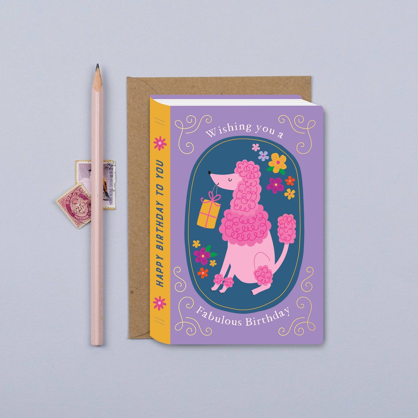 Pink poodle birthday card shaped like a book with floral accents