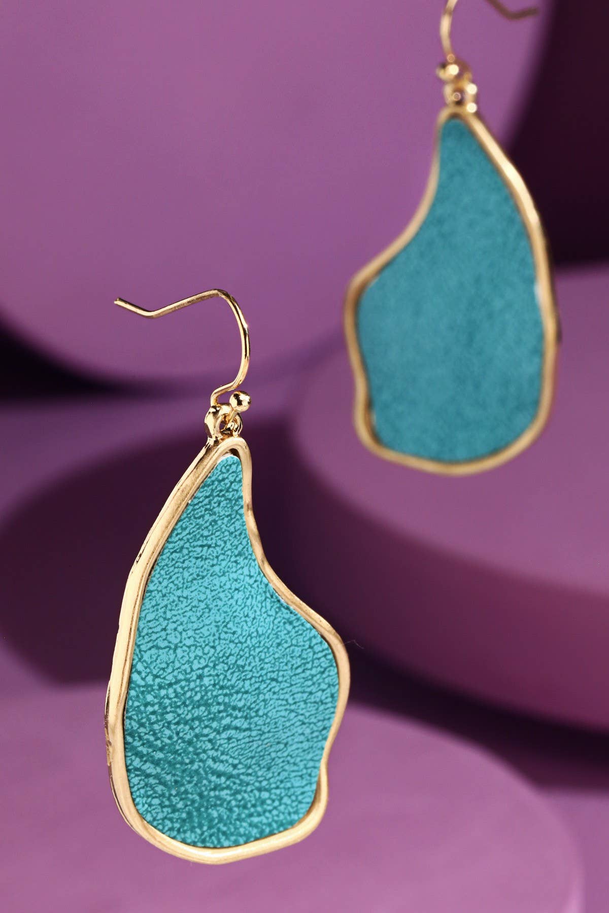 Turquoise dangle earrings with organic shape and gold-tone trim