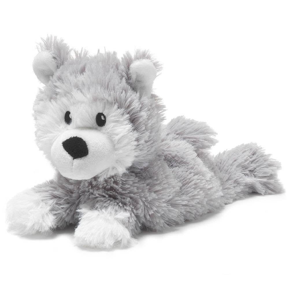 Soft gray plush husky lying down with white snout and paws