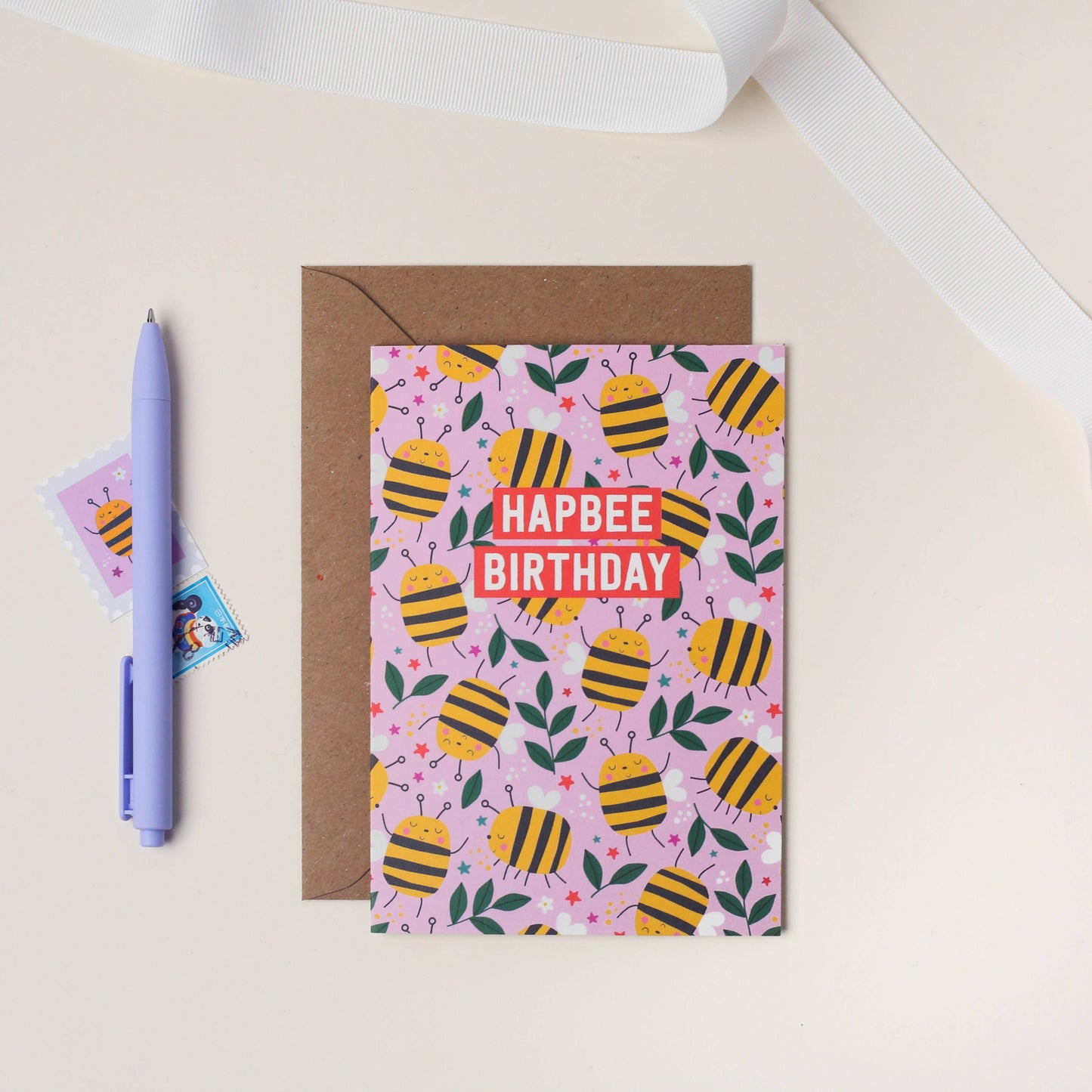 Colorful bee-themed birthday card with 'Hapbee Birthday' text on pink background