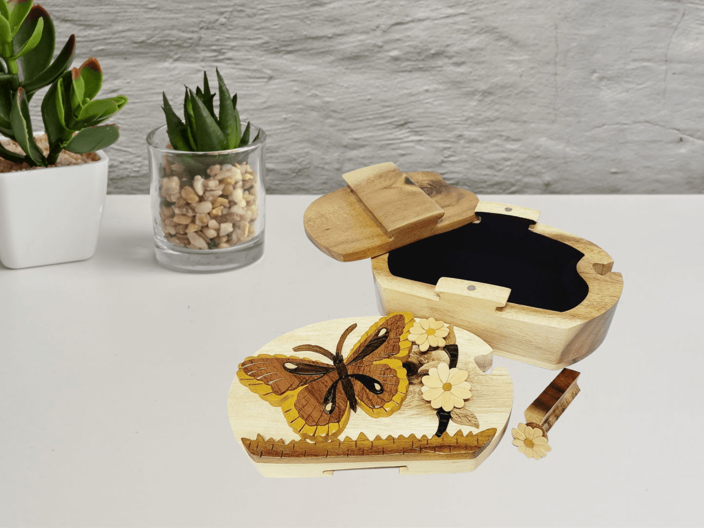 Hand-carved wooden box with butterfly and daisies inlay, perfect for unique gifts.