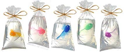 Clear glycerin soap with colorful toy fish, packaged to look like a carnival fish in a bag.