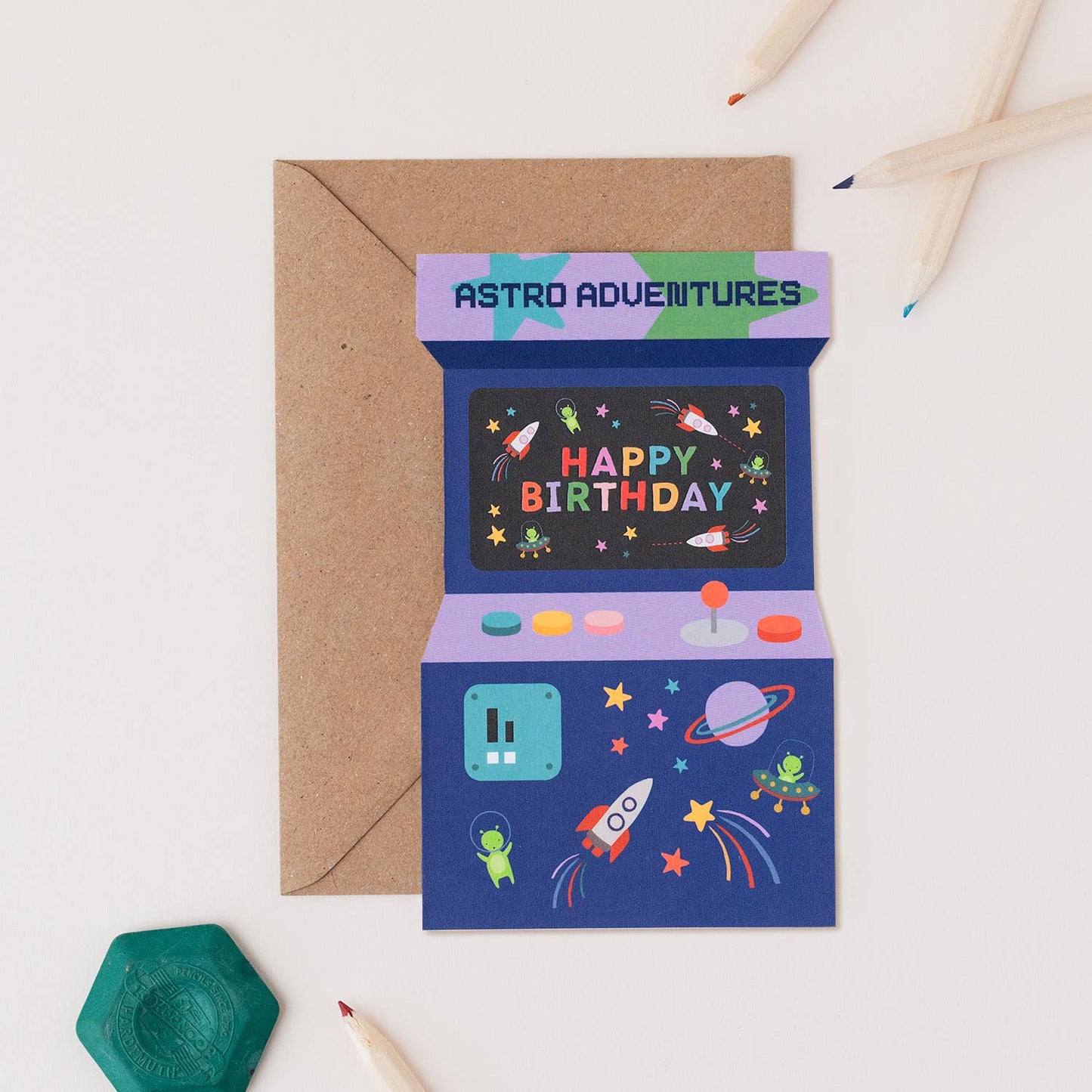 A colorful "Astro Adventures" arcade game birthday card featuring space-themed illustrations and a "Happy Birthday" message.