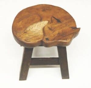 Wooden stool with hand-carved sleeping fox design on the seat