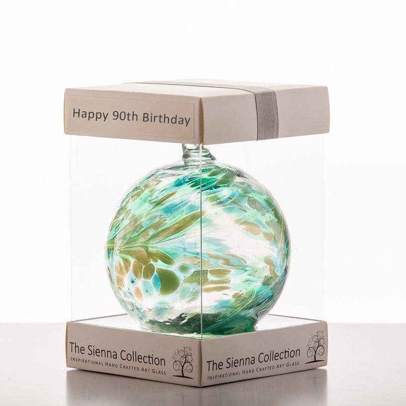 Mouth blown glass friendship ball in green and blue tones, boxed for 90th birthday