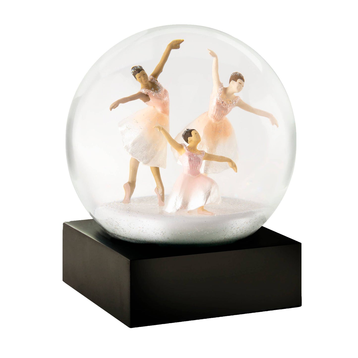 Three ballerinas in pastel pink dresses dance gracefully inside a snow globe with a black square base.