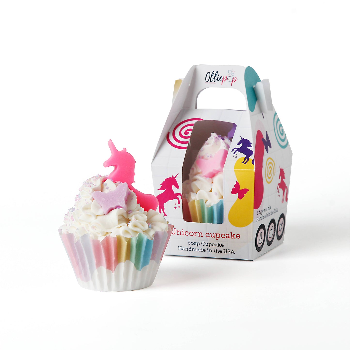 Handmade unicorn cupcake soap with rainbow swirls, white frosting, and a pink unicorn topper.